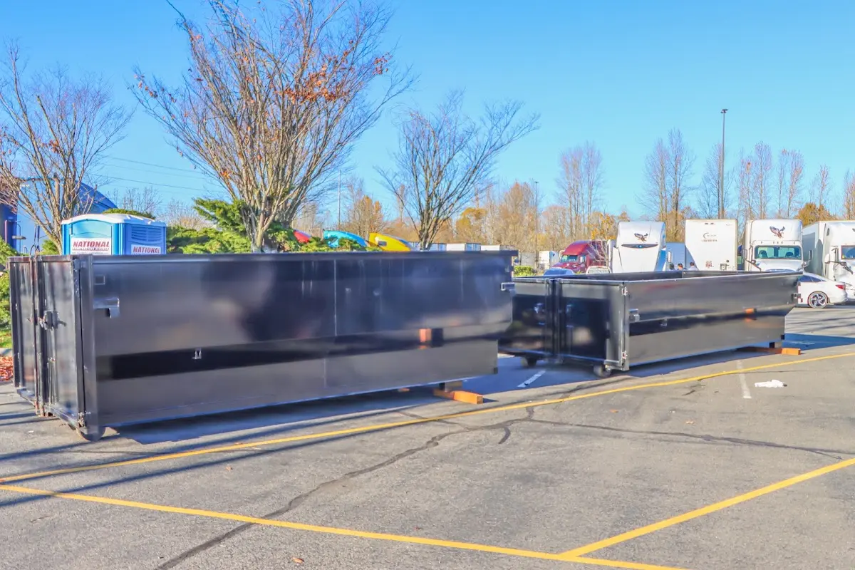 Professional dumpster rental service with roll-off container on residential driveway in Dade City